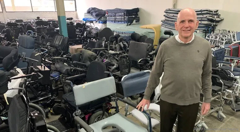 Bob Shea, co-founder standing in a room full of equipment